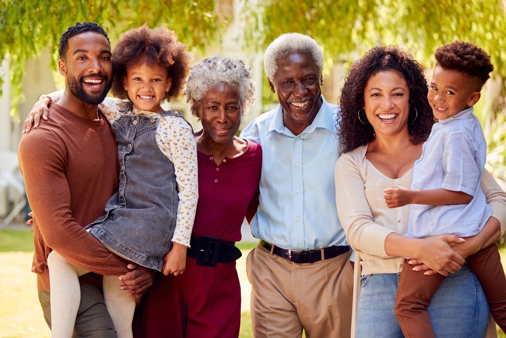 Portrait Of Smiling Multi-Generation Family At Home In Garden Together