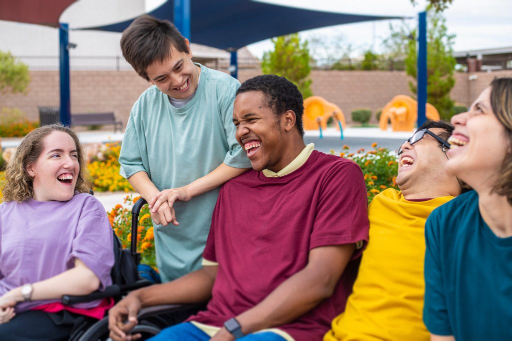 group of disabled individuals laughing